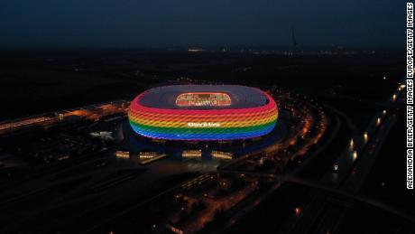 Munich&#39;s Allianz Arena is illuminated in rainbow colors during the Bundesliga match between Bayern Munich and Hoffenheim on January 30, 2021.
