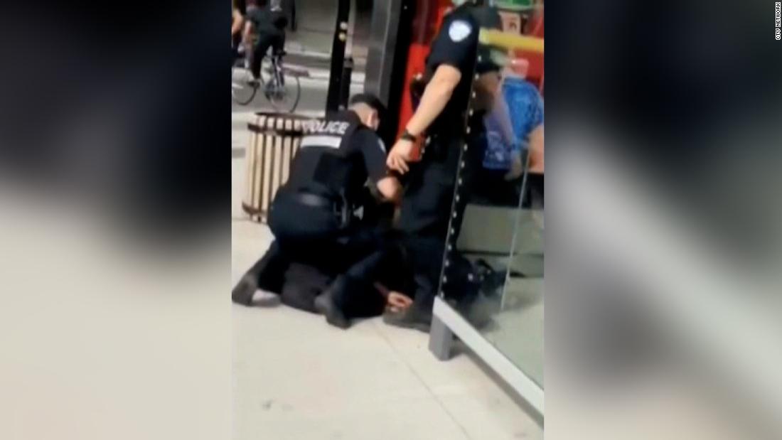 Canadian legislator calls for investigation into video of a police officer kneeling on a teenager's neck