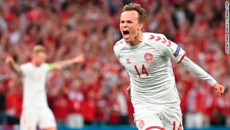 Denmark&#39;s Mikkel Damsgaard celebrates after scoring his side&#39;s opening goal against Russia.