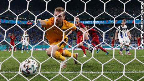 Finland goalkeeper Lukas Hradecky scores an own goal as he attempts to save from Thomas Vermaelen of Belgium during the Euro 2020 Group B match in St. Petersburg.
