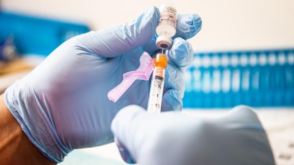 A healthcare worker prepares a dose of the Pfizer-BioNTech Covid-19 vaccine at Boston Medical Center in Boston, Massachusetts, U.S., on Thursday, June 17, 2021. The first pandemic surge flooded Boston Medical Center with coronavirus patients: 229 at last springs peak, filling nearly two-thirds of its beds. This week, the Covid-19 count hit zero. Photographer: Adam Glanzman/Bloomberg via Getty Images