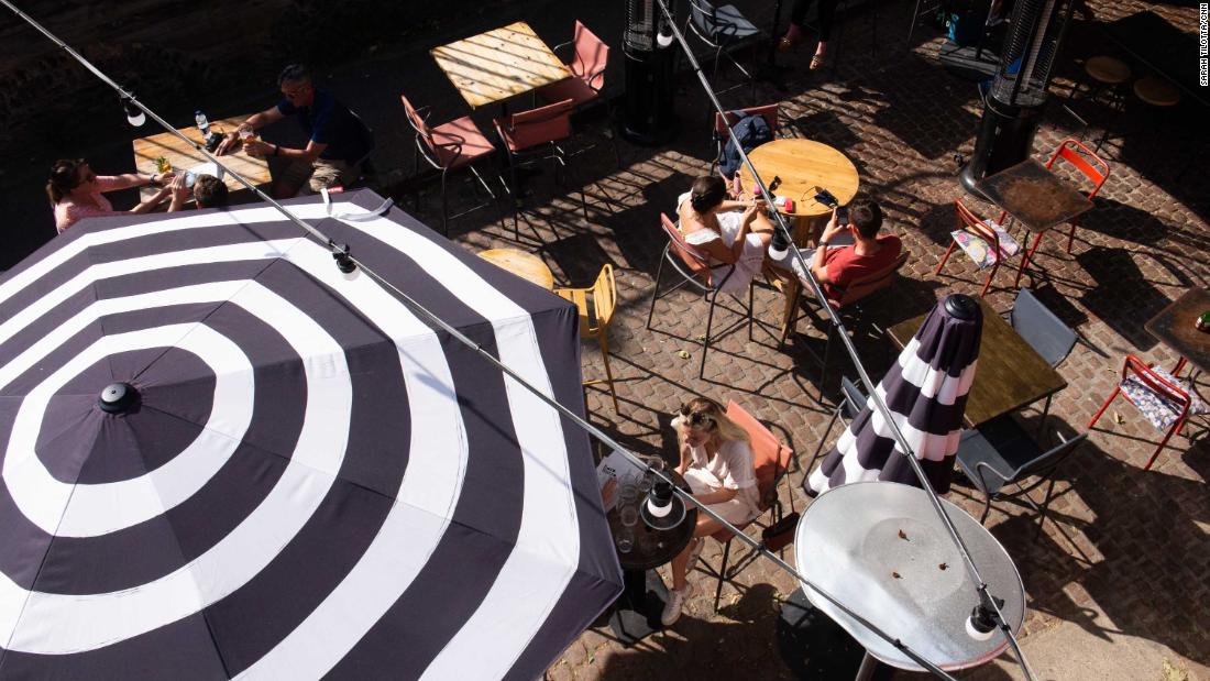 Diners on a terrace near London's Borough Market last month. Brits have been allowed to go for a meal outdoors or indoors with up to six people or as two households since mid-May.