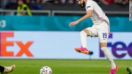 Benzema scores past Portugal&#39;s goalkeeper Rui Patricio.