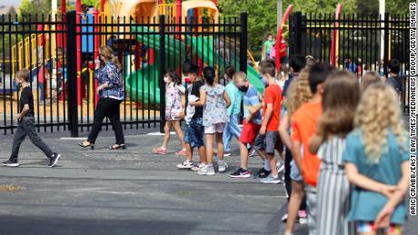 Teacher Nusheen Saadat, second from left, leads students across campus during a summer school session June 14 at Golden View Elementary School in San Ramon, California.
