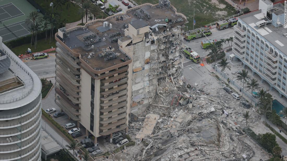 The partial collapse left huge piles of rubble and materials dangling from what remained of the structure.