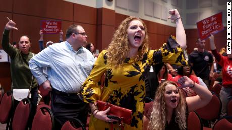 Angry parents and community members protest after a Loudoun County School Board meeting was halted by the school board because the crowd refused to quiet down, in Ashburn, Virginia, on Tuesday.