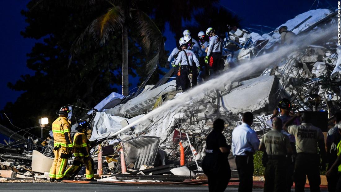 Rescue personnel work at the site on June 24.