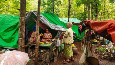 Internally displaced women talk at their makeshift tents at Pu Phar Village, Demawso Township, Kayah state on June 17.