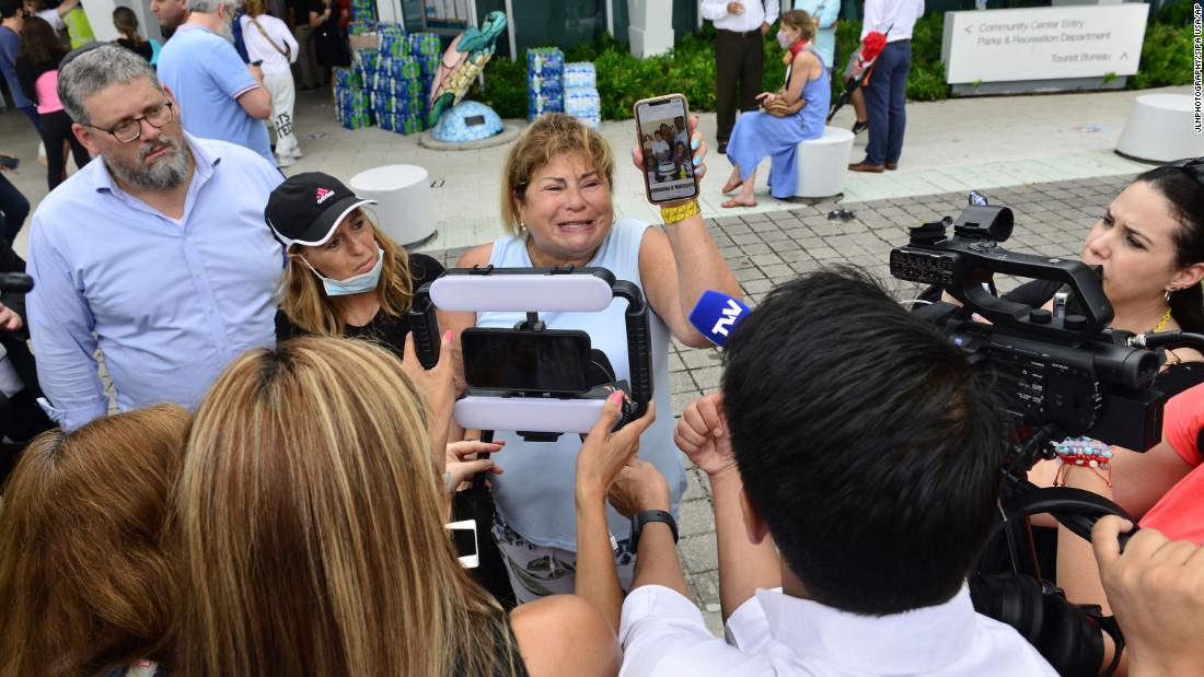 Yube Pettingill talks to the media. Two of her family members were still missing.