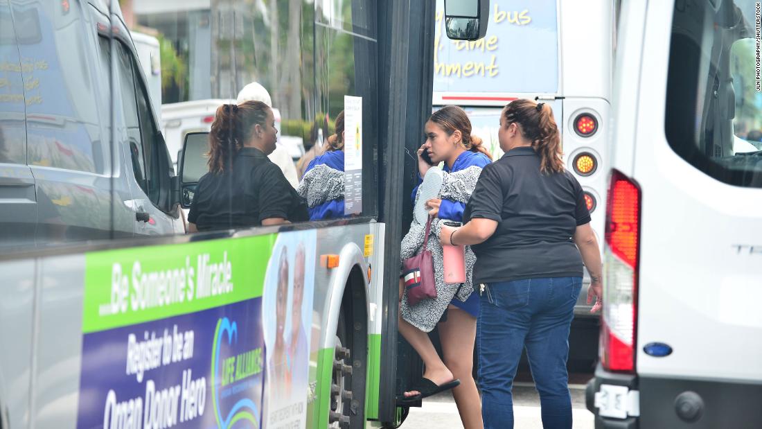 Displaced residents are taken to a nearby hotel in Surfside.