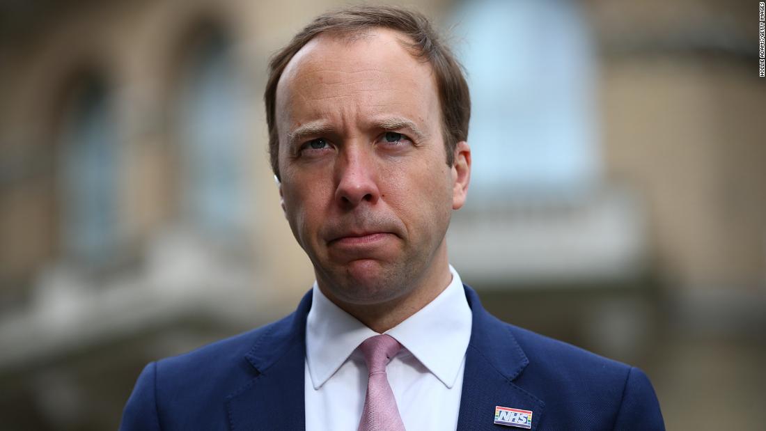 Matt Hancock, Britain's beleaguered health secretary, apologizes after being caught in embrace with aide