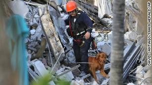 Rescuers battle fire, noise and shifting steel and concrete as they scramble to save lives
