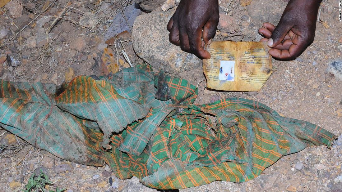 One photograph from the scene of clothing and an ID card left at the scene of the massacre in Mahibere Dego, Tigray.