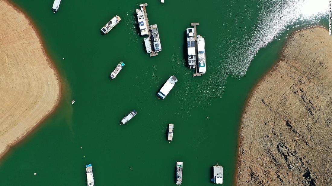 This aerial photo shows houseboats anchored at the Bidwell Canyon Marina in Oroville, California, on June 1. As water levels continued to fall at Lake Oroville, officials were flagging houseboats for removal so they could avoid being stuck or damaged.