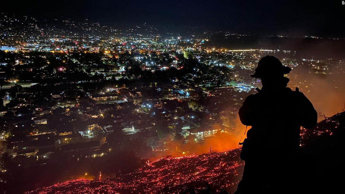 Firefighters battle a brushfire in Santa Barbara, California, in May 2021.