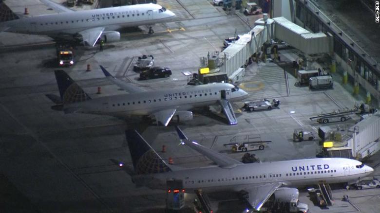 After an altercation on board, a man jumps out of a taxiing airplane at Los Angeles airport