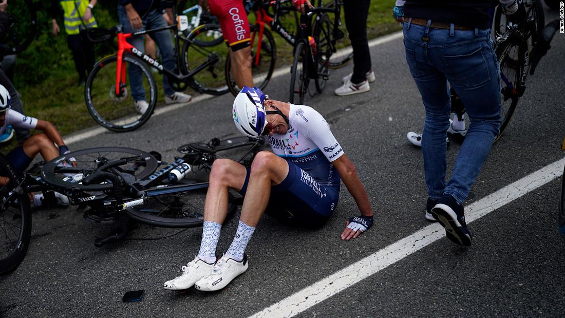 Fan holding sign causes huge crash during first stage of Tour de France