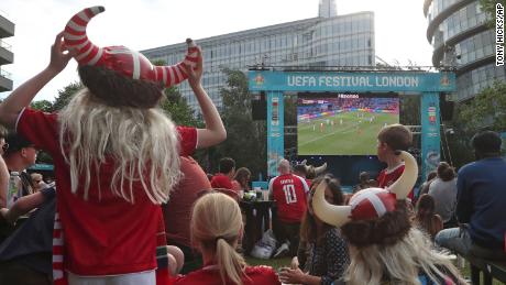 Danish supporters react at a fan area in Potters Field in London.