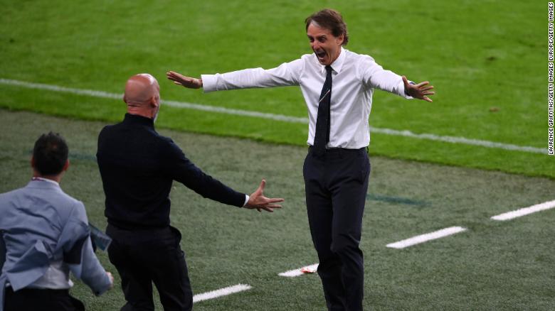 Italy manager Roberto Mancini celebrates after Chiesa scored Italy&#39;s goal against Austria.