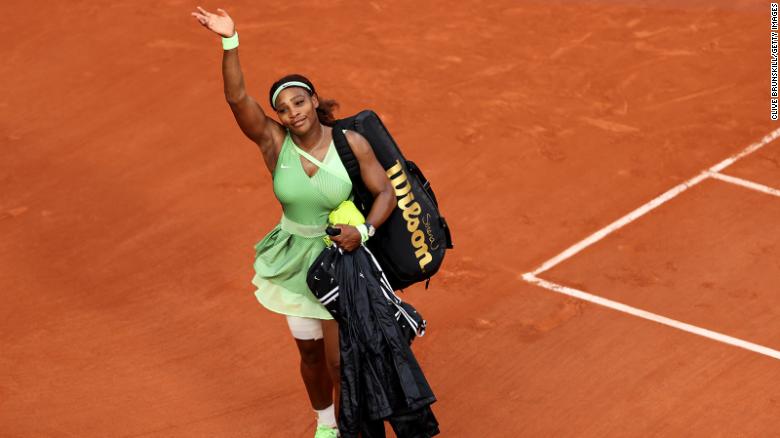 Williams waves goodbye to the crowd after her straight sets defeat  to Elena Rybakina at the 2021 French Open.