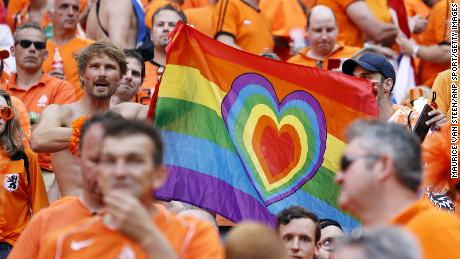 Netherlands supporters hold a rainbow flag during the Euro 2020 match between the Netherlands and the Czech Republic at the Puskas Arena.