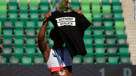 Berry displays a T-shirt during her podium protest at the Olympic trials.