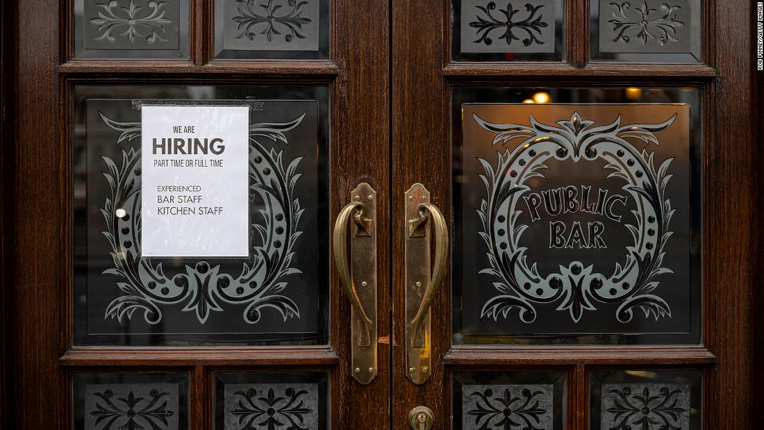 A hiring sign is seen in the window of a pub in Westminster on June 4, 2021 in London, England. Demand for workers in the hospitality sector has increased significantly following the easing of coronavirus restrictions, but many businesses are struggling to find staff. 