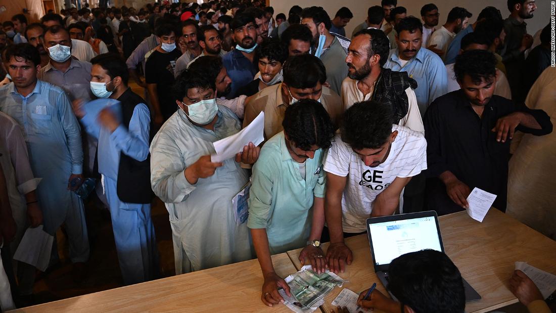 Desperate expatriate workers storm Islamabad vaccination center
