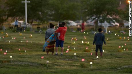 Flags and solar lights at the former Marieval Indian Residential School in Saskatchewan now mark the site where hundreds of unmarked graves were recently discovered. 