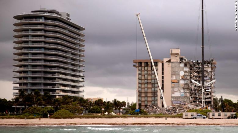 Ultra-luxury tower known as Eighty Seven Park, left, across from the ruins at Champlain Towers South.