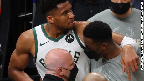 Giannis Antetokounmpo is helped off the court after being injured during Game 4 of the Eastern Conference Finals. 