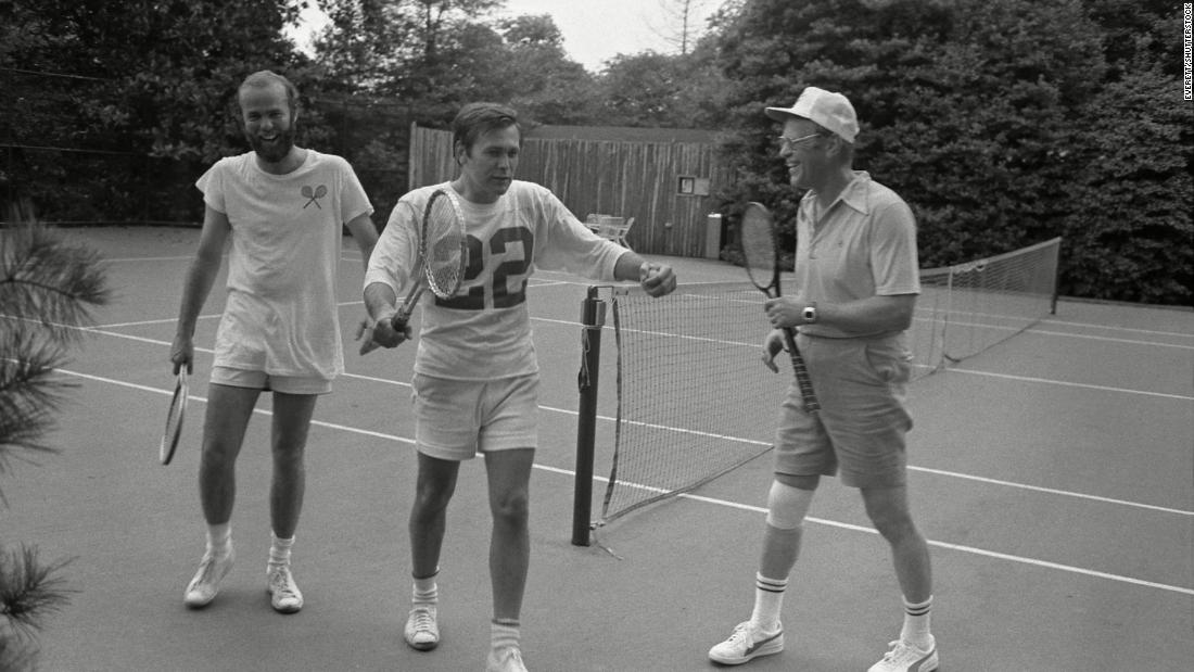 Rumsfeld, center, plays tennis at the White House with President Ford, right, and chief White House photographer David Hume Kennerly in 1975.