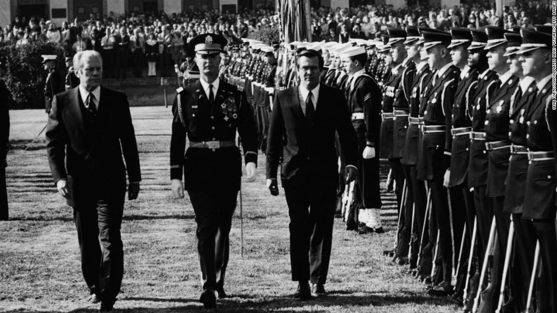 Ford and Rumsfeld review a line of troops on the Pentagon lawn in 1975. Rumsfeld, at 43 years old, was the youngest defense secretary in US history when he took the position.