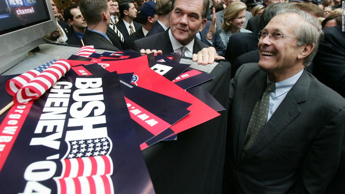 Rumsfeld and Homeland Security Secretary Tom Ridge watch news coverage of the presidential election in November 2004. Bush defeated John Kerry to win re-election.