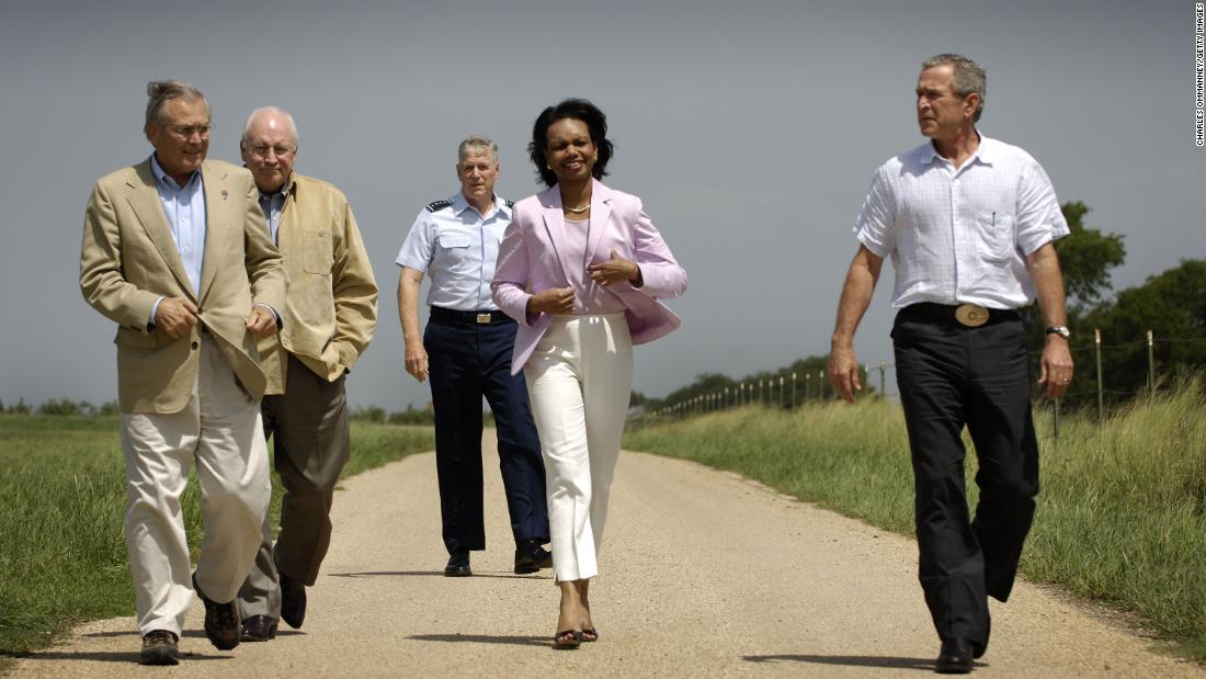 From left, Rumsfeld, Vice President Dick Cheney, Chairman of the Joint Chiefs of Staff Gen. Richard Myers and Secretary of State Condoleezza Rice walk with Bush at the President&#39;s ranch in Crawford, Texas, in August 2005.