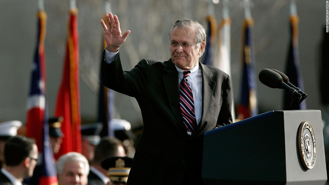 Rumsfeld waves after making remarks at his retirement ceremony in December 2006.