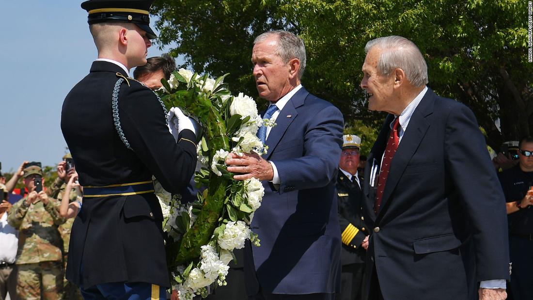 Rumsfeld and Bush take part in a wreath-laying ceremony at the Pentagon Memorial on the September 11 anniversary in 2019.