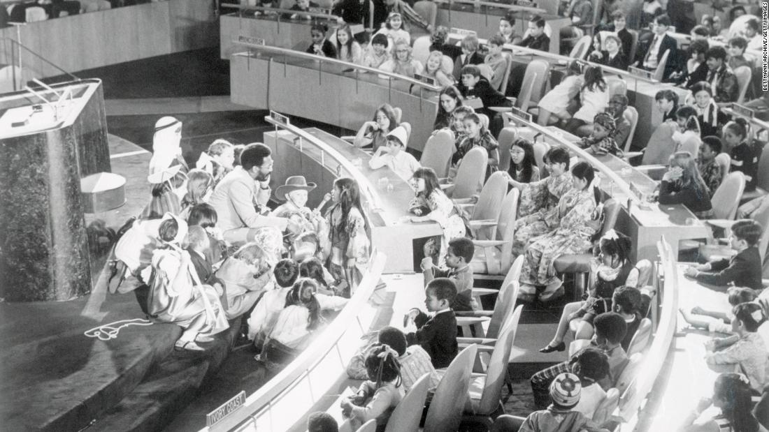 Cosby talks with children at the United Nations in New York, where he was taping an international Christmas message in 1970.