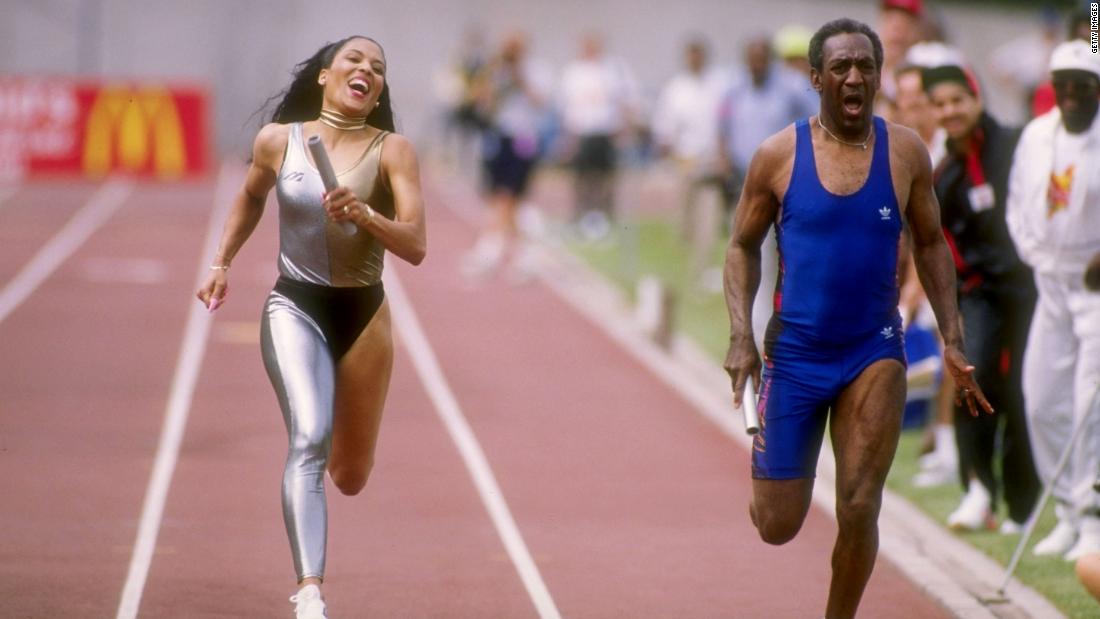 Cosby races Olympic champion Florence Griffith-Joyner in 1989.