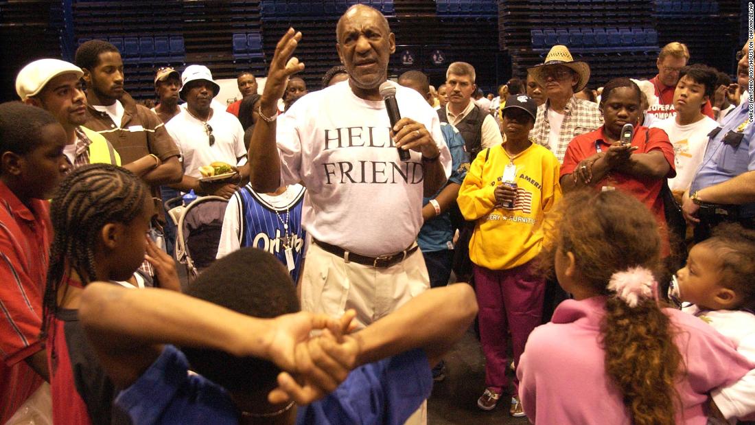 Cosby talks to Hurricane Katrina refugees in Houston in September 2005. His shirt reads &quot;Hello, friend&quot; — a tribute to his late son, Ennis, who used that as a regular greeting.