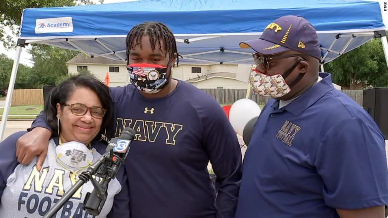 The mother of a Naval Academy football prospect is killed by random gunfire after dropping off her son at school