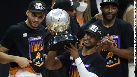 Chris Paul holds the Western Conference Championship trophy after the Suns defeated the LA Clippers.