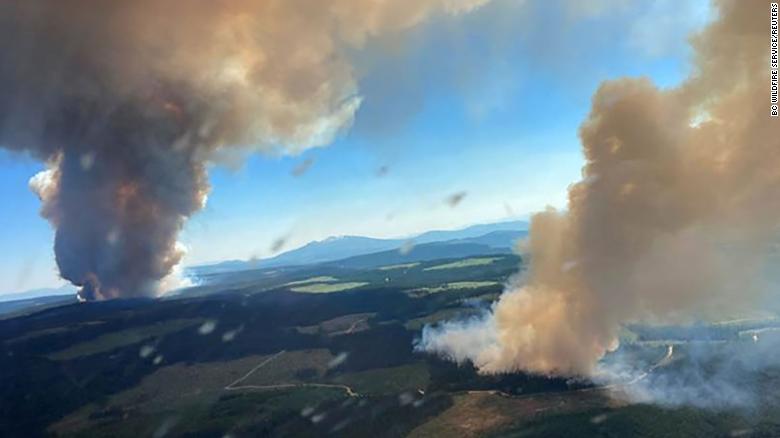 Smoke rises from a fire at Long Loch and Derrickson Lake in Central Okanagan in Canada on June 30.