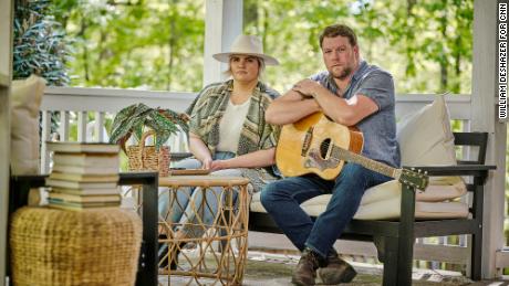 Emily and Ben Roberts, the husband-and-wife duo of Carolina Story, on their front porch outside of Nashville. 