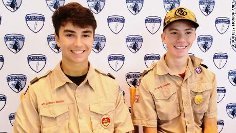 Boy Scouts Dominic Viet, left, and Joseph Diener saved a woman from drowning in floodwaters.