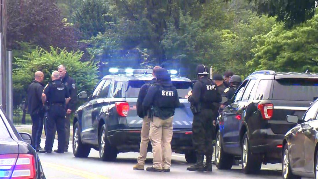 Massachusetts police standoff with heavily armed men ends in 11 arrests