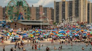 People gather at the beach as COVID-19 restrictions have eased at Coney Island beach on July 4, 2021 in New York City. In a tweet, the New York Police Department stated they expect up to one million people to visit Coney Island for the Fourth of July holiday weekend. 