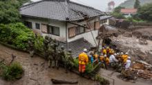 ATAMI, JAPAN - JULY 04: Rescue workers search for missing people at the site of a landslide on July 04, 2021 in Atami, Shizuoka, Japan. A rescue operation is underway after a landslide, caused by torrential rain, tore through the Japanese resort city of Atami on Saturday, killing two and leaving around twenty missing. (Photo by Yuichi Yamazaki/Getty Images)