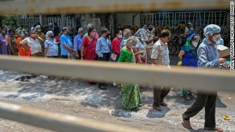 People line up to receive coronavirus vaccine shots in Mumbai, India, on May 4.