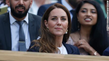 Britain&#39;s Catherine, Duchess of Cambridge sits in the royal box before Tunisia&#39;s Ons Jabeur and Spain&#39;s Garbine Muguruza play their women&#39;s singles third round match on the fifth day of the 2021 Wimbledon Championships at The All England Tennis Club in Wimbledon, southwest London, on July 2, 2021. - RESTRICTED TO EDITORIAL USE (Photo by Adrian DENNIS / AFP) / RESTRICTED TO EDITORIAL USE (Photo by ADRIAN DENNIS/AFP via Getty Images)